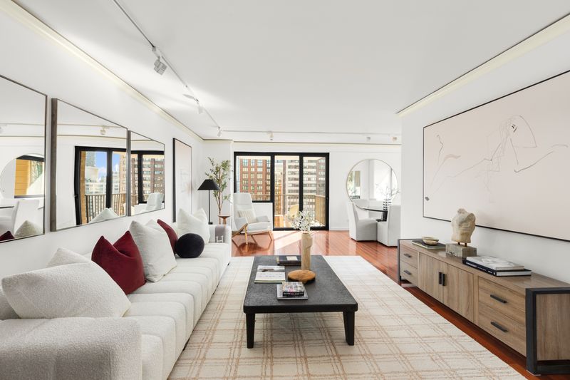 29-foot living room with south-facing windows at 10 West 66th Street 29E, Lincoln Square — photo 2 of 9