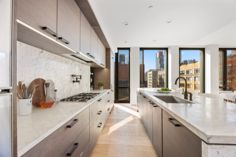 galley kitchen, marble counters to city glass at 100 Barrow Street 9A