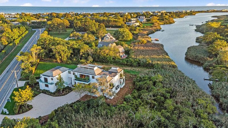 Aerial along Sam's Creek at 1076 Ocean Road, Bridgehampton — photo 3 of 11