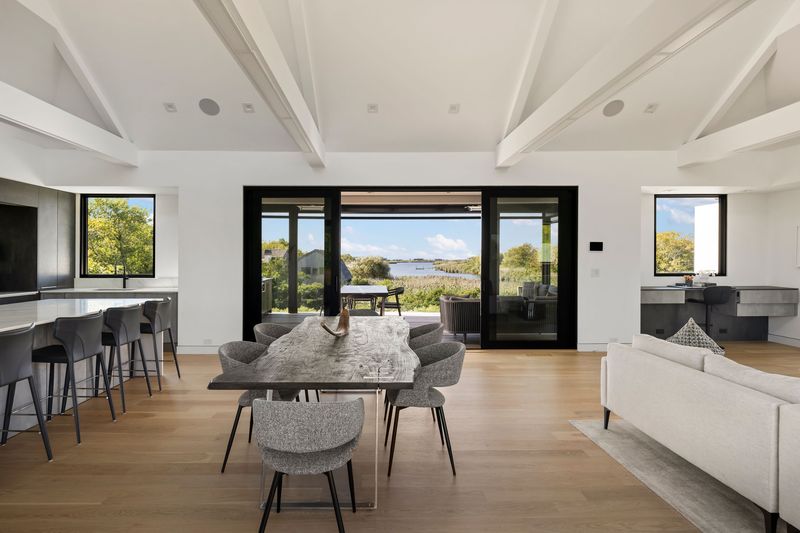 Dining beamed ceilings at 1076 Ocean Road, Bridgehampton — photo 8 of 11