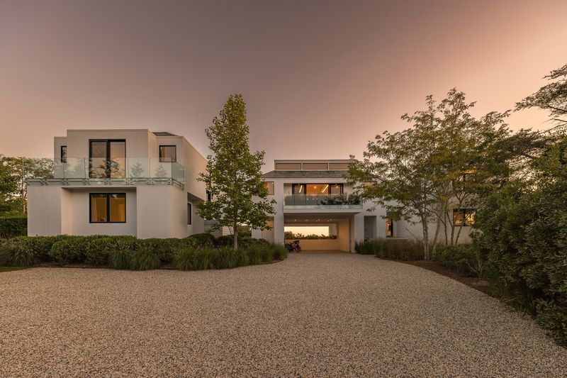 Front of house at dusk at 1076 Ocean Road, Bridgehampton — photo 11 of 11