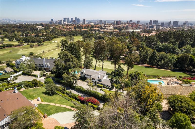 Aerial of the estate, golf course and Westwood skyline at 10810 Ambazac Way, Bel Air — photo 4 of 12
