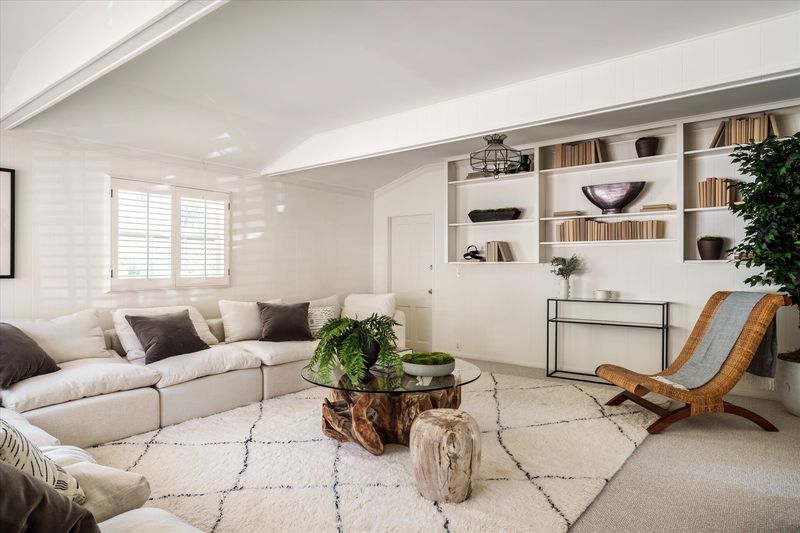 Family room with white sectional at 10810 Ambazac Way, Bel Air — photo 5 of 12