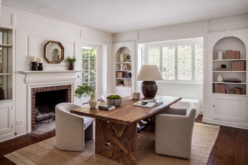 Study with brick fireplace and arched bookcases at 10810 Ambazac Way, Bel Air — photo 8 of 12