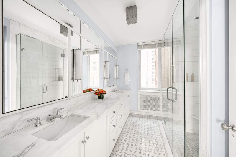 Marble primary bath at 1100 Park Avenue 6B, Carnegie Hill — photo 8 of 10