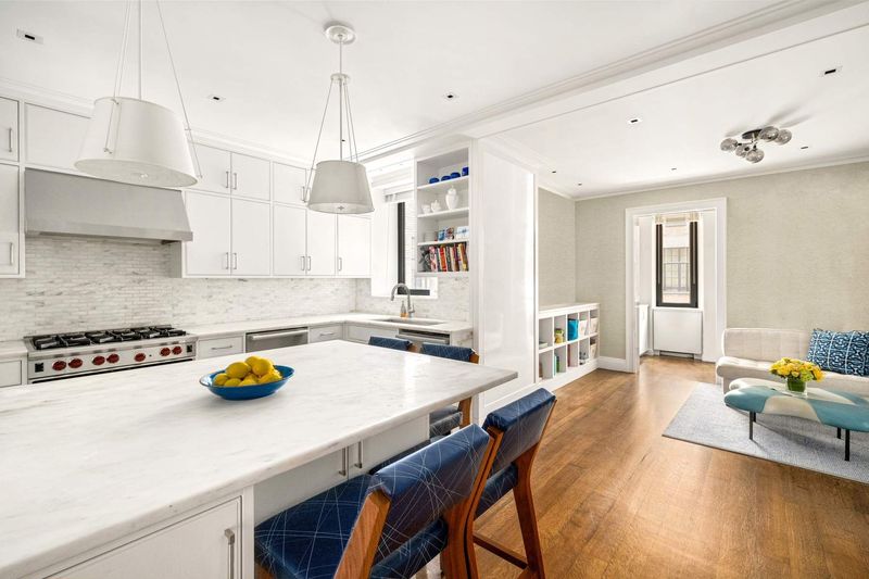 Kitchen into family room at 1100 Park Avenue 6B, Carnegie Hill — photo 9 of 10