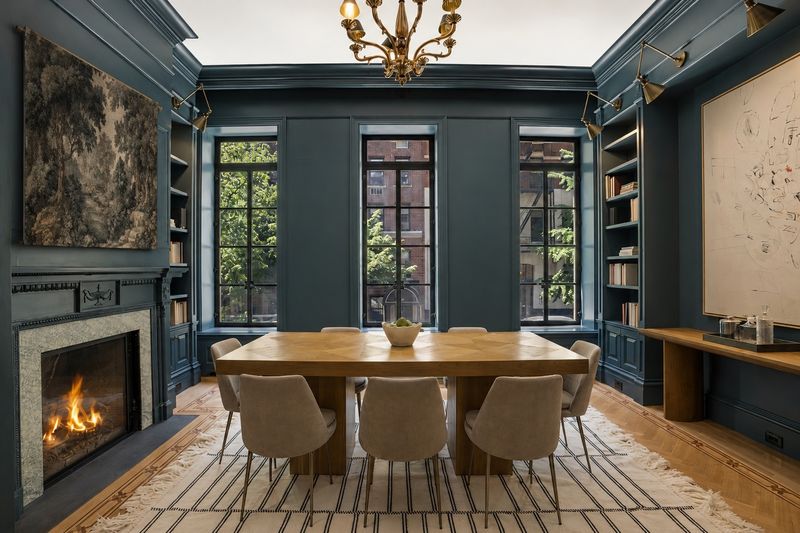 Teal dining library with fireplace and built-ins at 111 East 81st Street, Upper East Side — photo 6 of 8