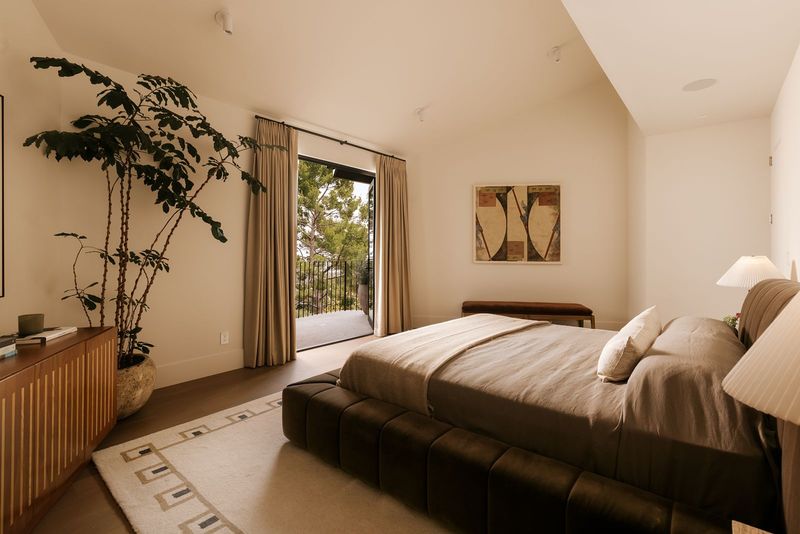 Bedroom opening to the garden at 1122 La Altura Road, Beverly Hills — photo 5 of 7
