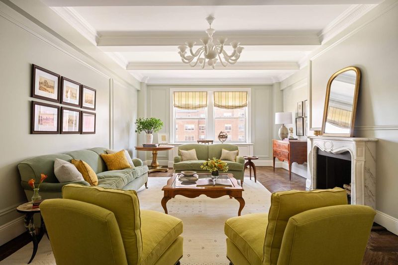 Living room with a fireplace at 1130 Park Avenue 91, Carnegie Hill