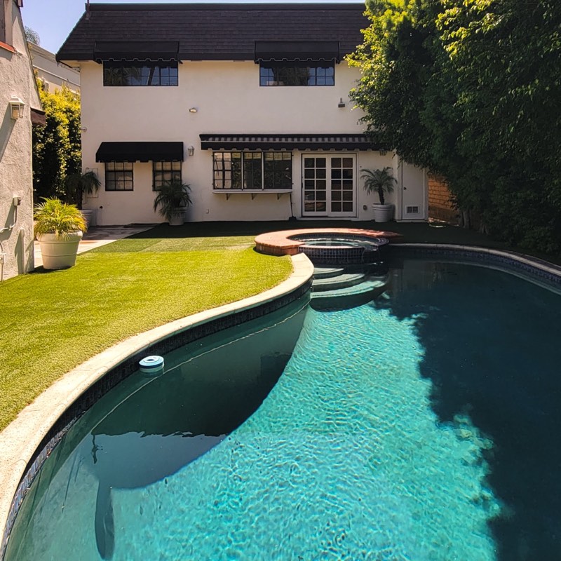 rear pool, spa, and lawn at 115 N Maple Drive