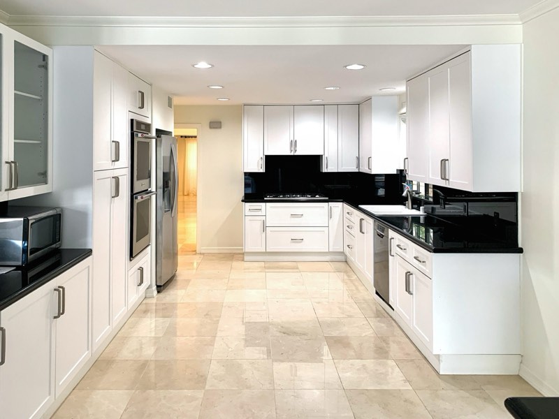 kitchen, white cabinets, black counters