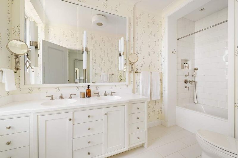 Renovated bath with a double vanity and walk-in shower at 1155 Park Avenue 10SW, Carnegie Hill — photo 8 of 12