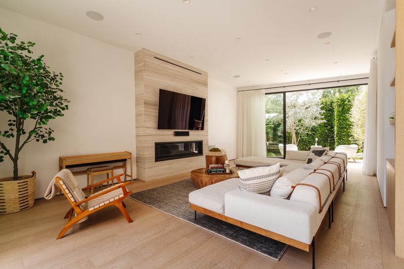Living room marble fireplace at 116 S Gretna Green Way, Brentwood — photo 3 of 10