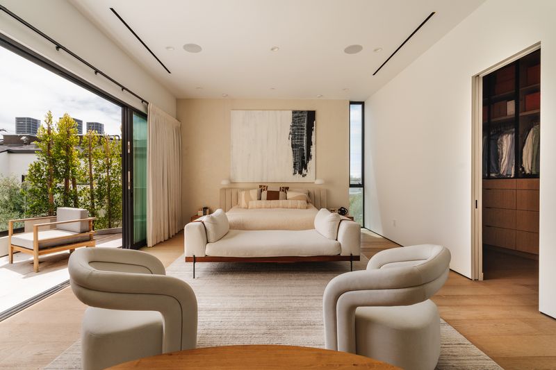 Primary suite with balcony at 116 S Gretna Green Way, Brentwood — photo 8 of 10