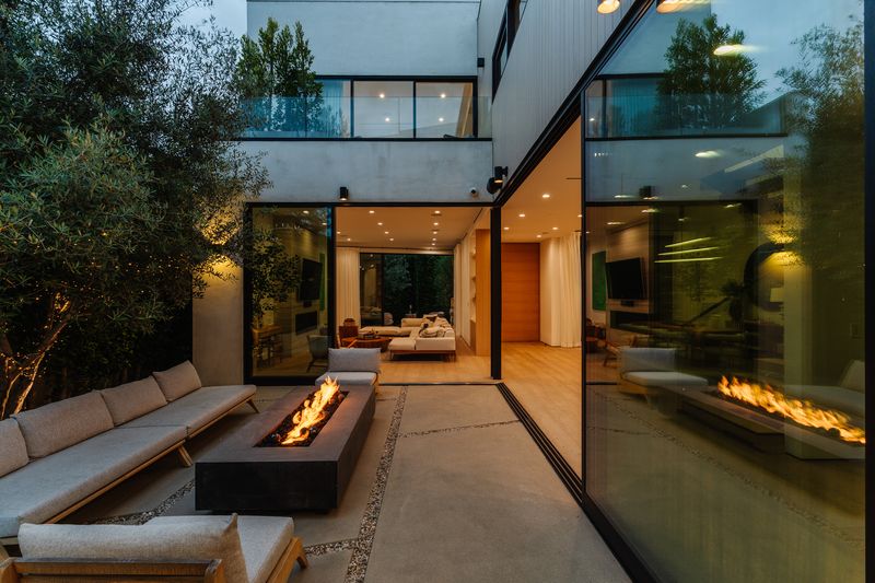 Fire pit courtyard at twilight at 116 S Gretna Green Way, Brentwood — photo 9 of 10