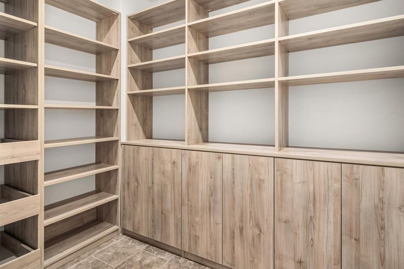 Built-in white-oak library wall at 1200 Fifth Avenue 15A, Carnegie Hill — photo 12 of 13