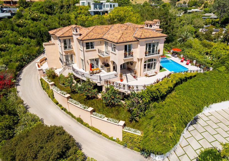 The estate and pool on its hillside promontory at 1260 St Ives Place, Bird Streets, Hollywood Hills