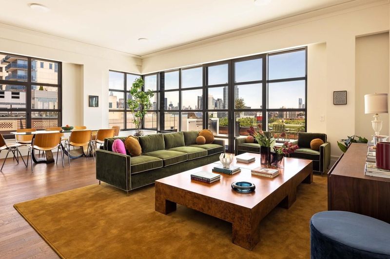 Great room with steel casement windows at 127 Kent Avenue PH1A, Williamsburg
