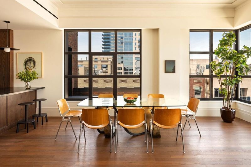 Dining area under a casement window at 127 Kent Avenue PH1A, Williamsburg — photo 2 of 8
