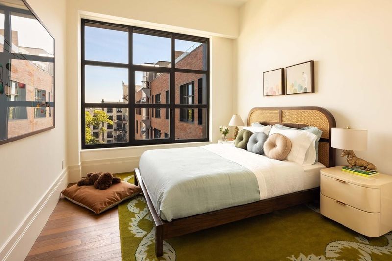 Secondary bedroom with corner windows at 127 Kent Avenue PH1A, Williamsburg — photo 7 of 8