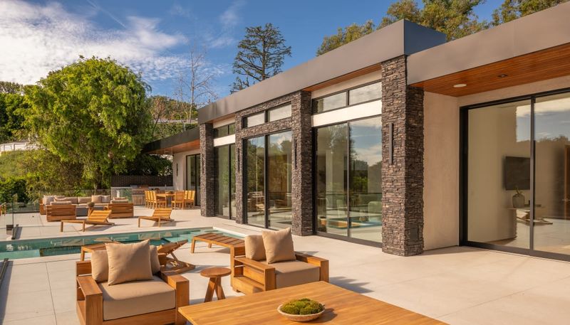 Pool terrace with outdoor lounge at 12752 Mulholland Drive, Beverly Hills — photo 2 of 8