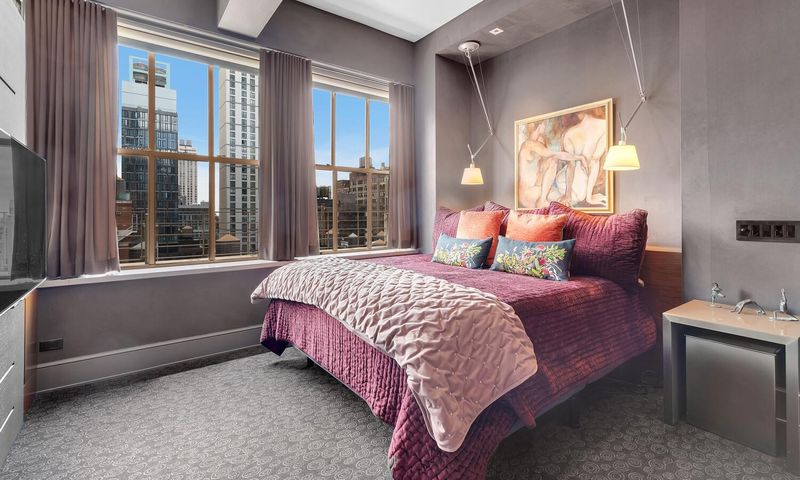 Primary bedroom at 130 West 30th Street 18A, Chelsea / NoMad — photo 7 of 8