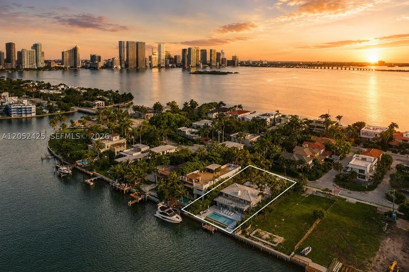Aerial view at sunset of the home on San Marco Island at 1300 South Venetian Way, San Marco Island — photo 3 of 10