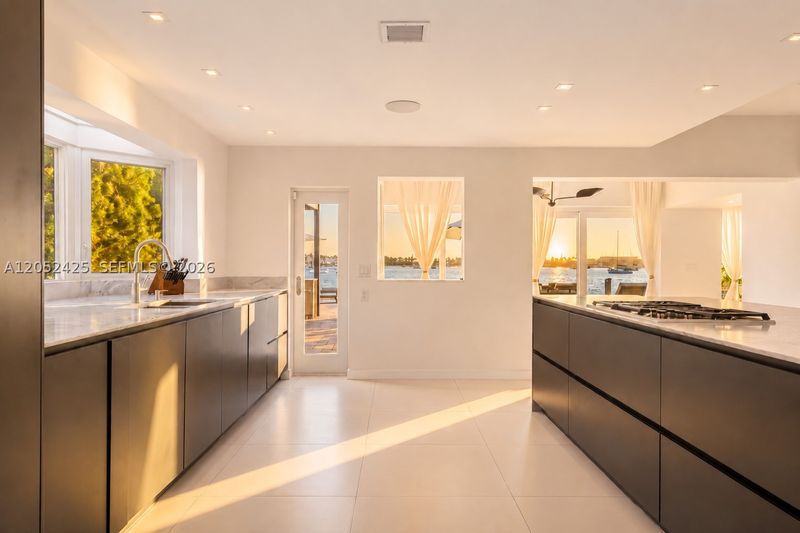The eat-in kitchen at 1300 South Venetian Way, San Marco Island — photo 6 of 10