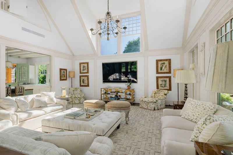 Double-height living room with floor-to-ceiling windows at 134 Herrick Road, Southampton Village — photo 4 of 12