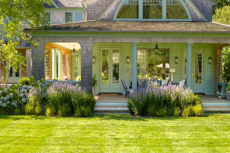 Wrap-around porch and cedar-shingled facade at 134 Herrick Road, Southampton Village — photo 7 of 12