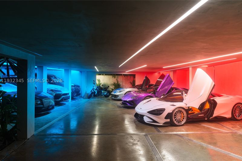 The understory garage, with room for up to 10 vehicles at 1413 North Venetian Way, San Marco Island — photo 9 of 9