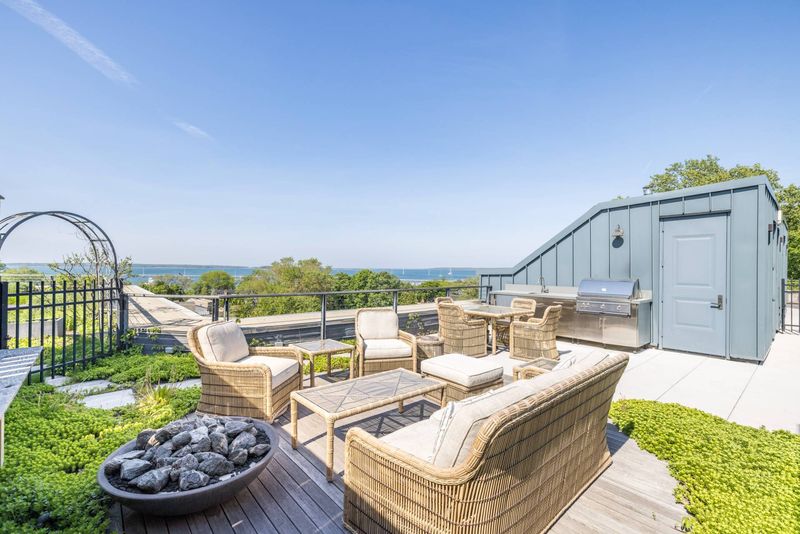 Rooftop lounge and fire pit at Watchcase, 15 Church Street PH-402, Sag Harbor Village — photo 2 of 8