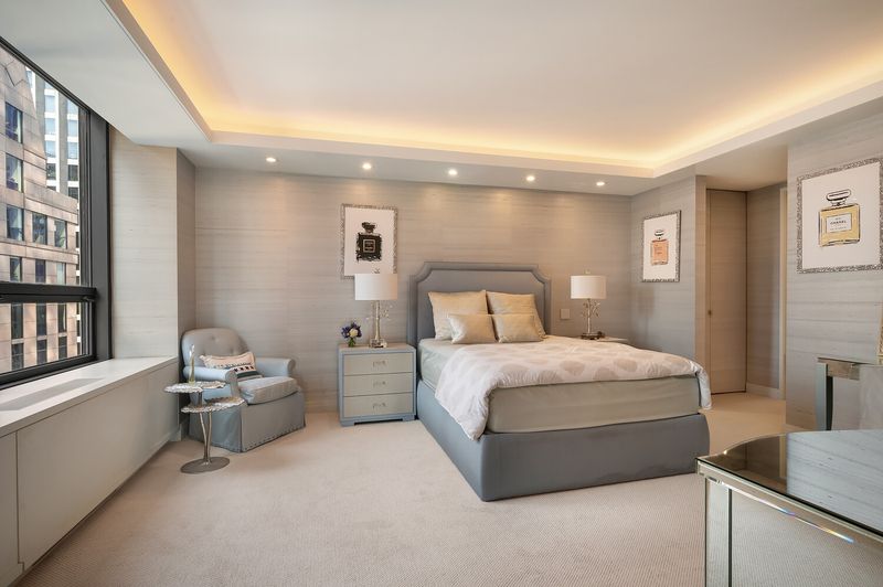 Bedroom with cove ceiling at 15 West 53rd Street #29BC, Midtown Manhattan — photo 10 of 12