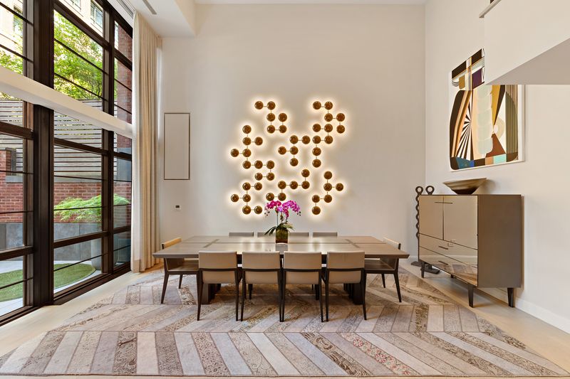 Living seating under sculptural lighting at 150 Charles Street M10, West Village — photo 2 of 12