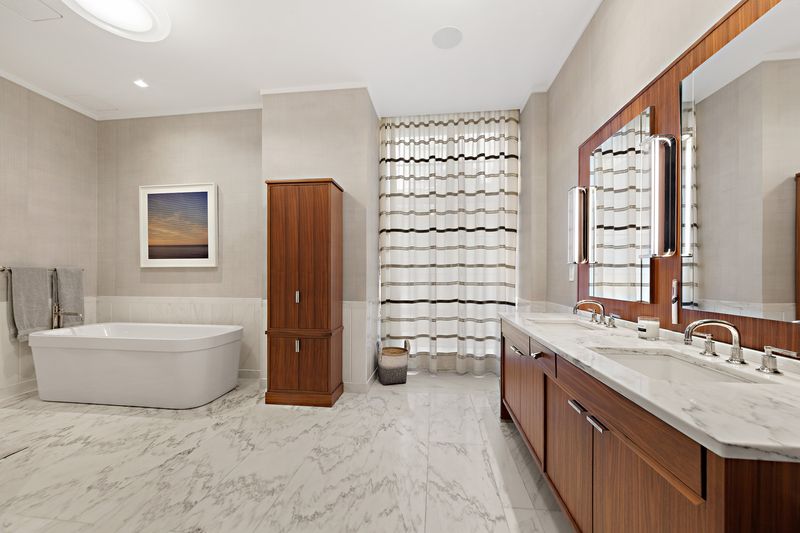Primary bath with soaking tub at 150 Charles Street M10, West Village — photo 7 of 12