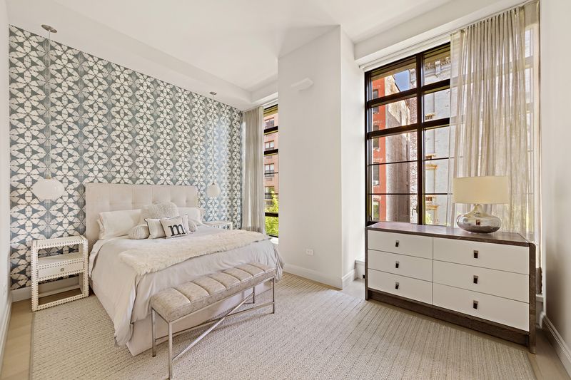 Bedroom with geometric wallpaper at 150 Charles Street M10, West Village — photo 8 of 12