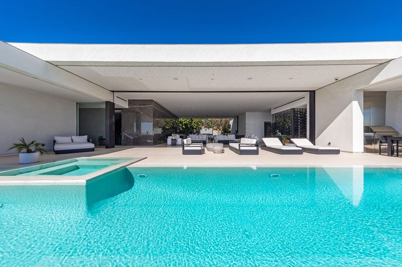 Pool and terrace from the far end of the deck at 1535 Carla Ridge, Trousdale Estates — photo 3 of 10