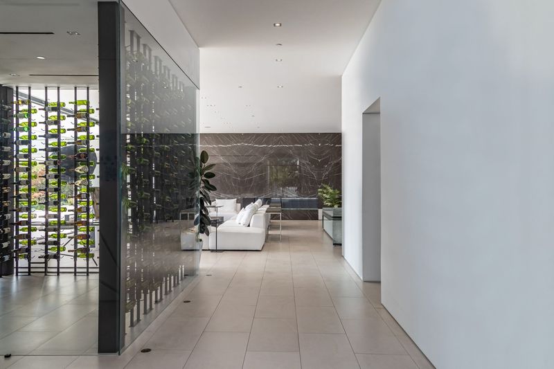 Gallery hall along the wine wall at 1535 Carla Ridge, Trousdale Estates — photo 8 of 10