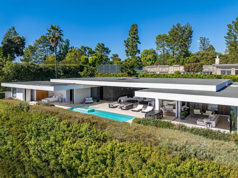Aerial of the house, pool and lawn at 1535 Carla Ridge, Trousdale Estates — photo 9 of 10