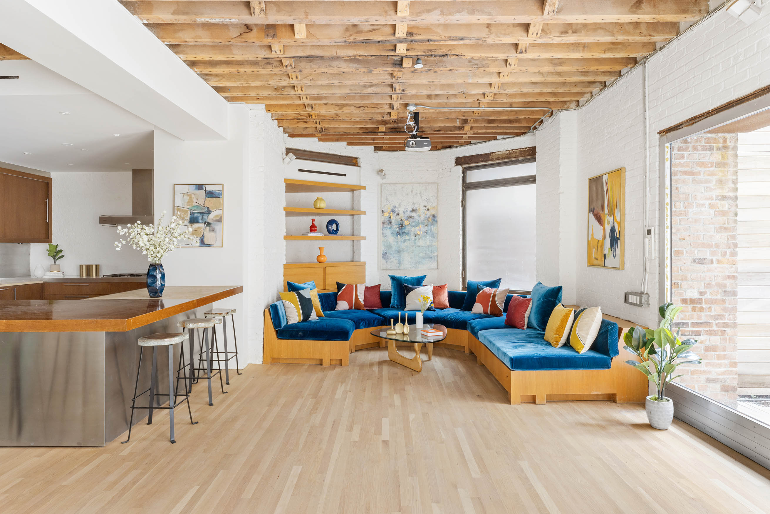 kitchen island and blue sectional at 16 Jay Street, Unit 1