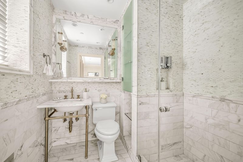White marble bath with console sink at 160 Central Park South 915, Central Park South — photo 4 of 6