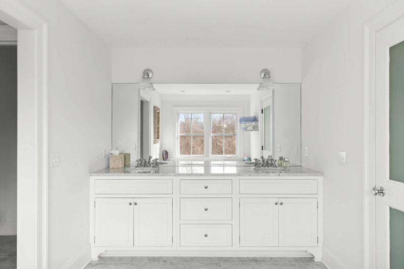 Double vanity in the primary bath at 162 Norris Lane, Bridgehampton — photo 5 of 5