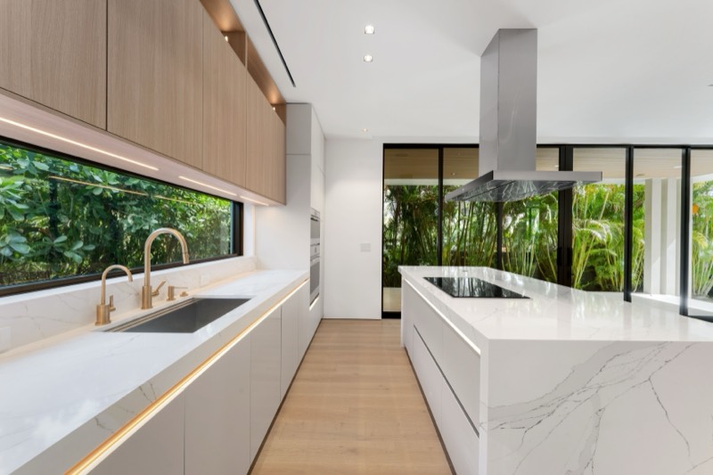Living area with walls of glass at 165 Hampton Lane, Key Biscayne — photo 2 of 6