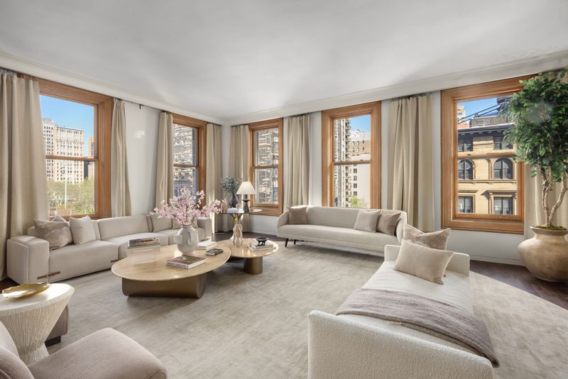 Window-lined living room with prewar windows at 170 Fifth Avenue, Unit 5, Flatiron