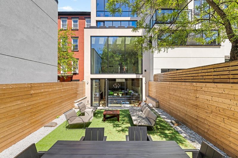 Rear glass facade from the landscaped garden at 172 North 6th Street, Williamsburg — photo 2 of 8