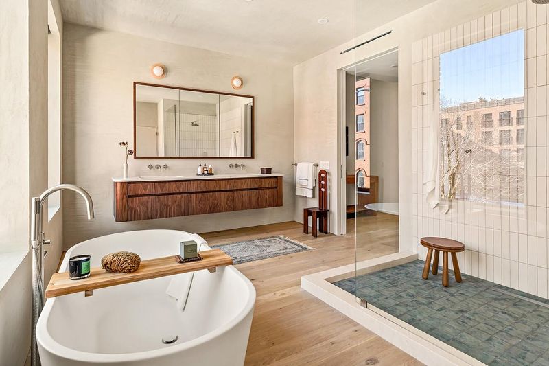 Primary bath with freestanding soaking tub at 172 North 6th Street, Williamsburg — photo 7 of 8