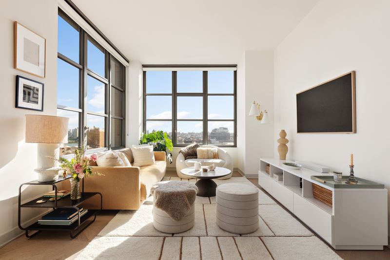 Living room with corner windows at 180 Front Street 11E, DUMBO — photo 3 of 9