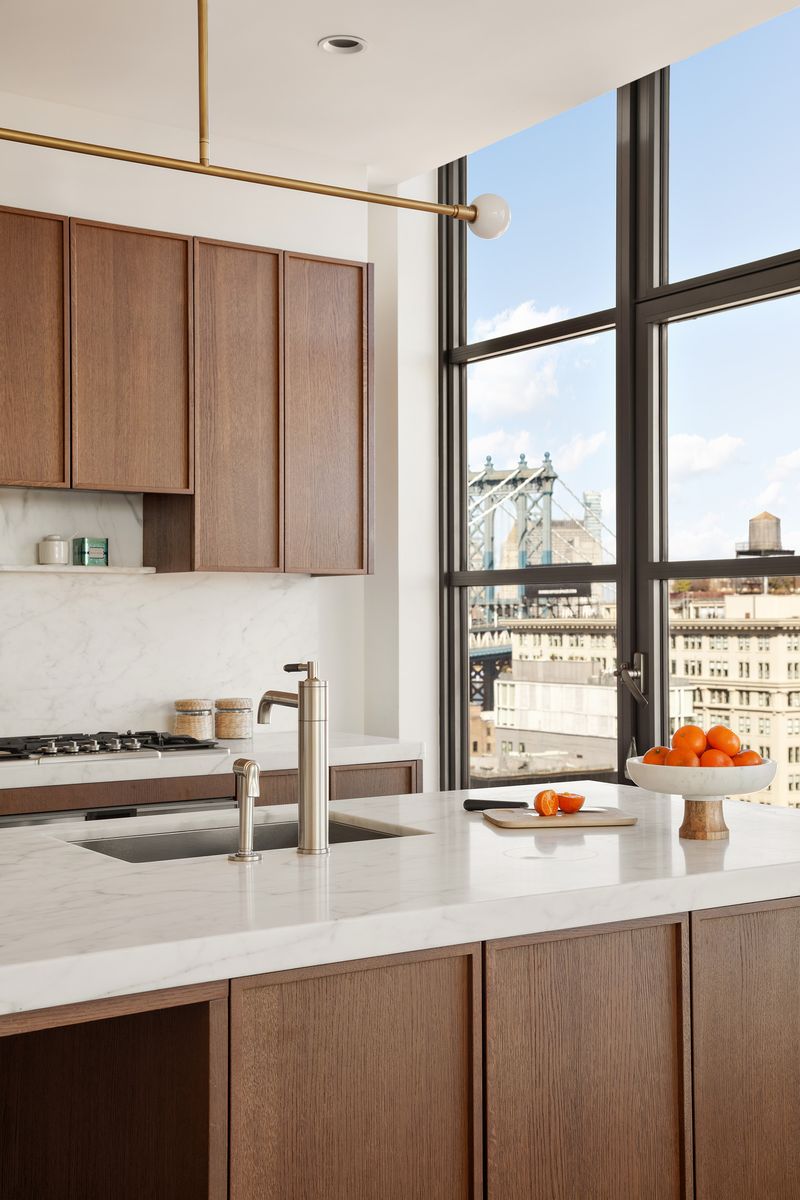 Marble kitchen with white oak cabinetry at 180 Front Street 11E, DUMBO — photo 4 of 9