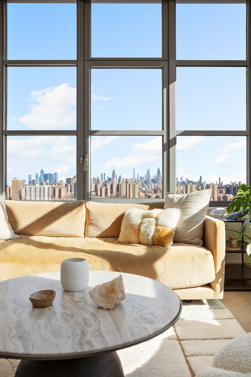 Living room with Manhattan views at 180 Front Street 11E, DUMBO — photo 5 of 9