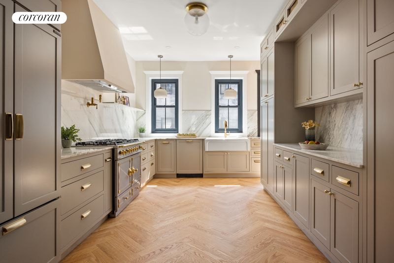 Kitchen with paneled cabinetry and herringbone oak at 198 Putnam Avenue, Bedford-Stuyvesant — photo 2 of 10